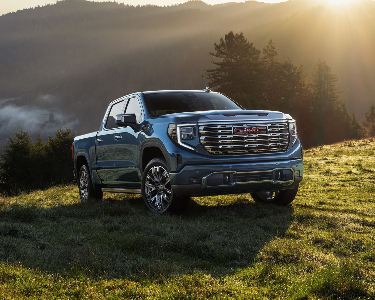 Front 3/4 shot of the 2025 GMC Sierra 1500 parked on hillside.