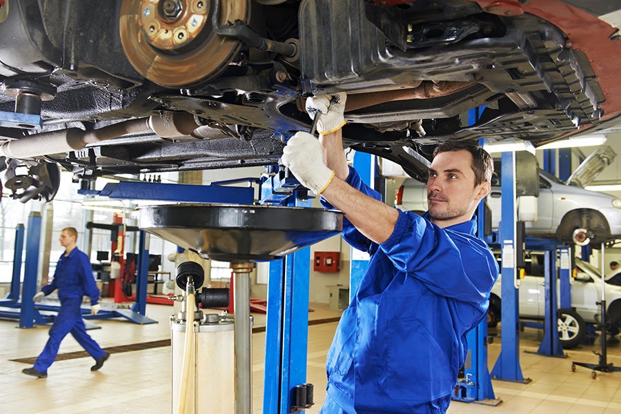 Mechanic working underneath a car